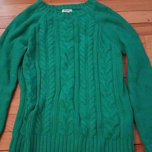 Green knotted sweater